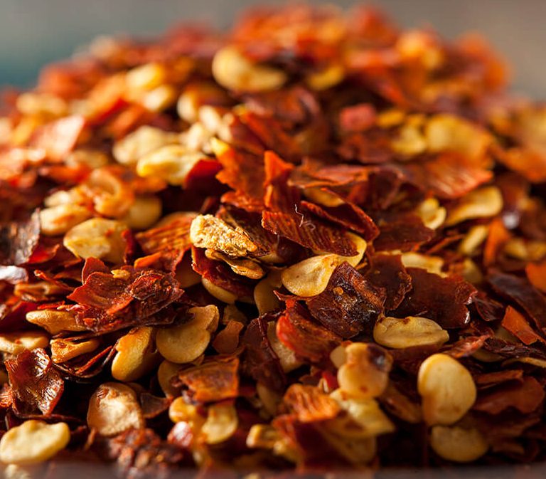 chilli flakes in pile on table